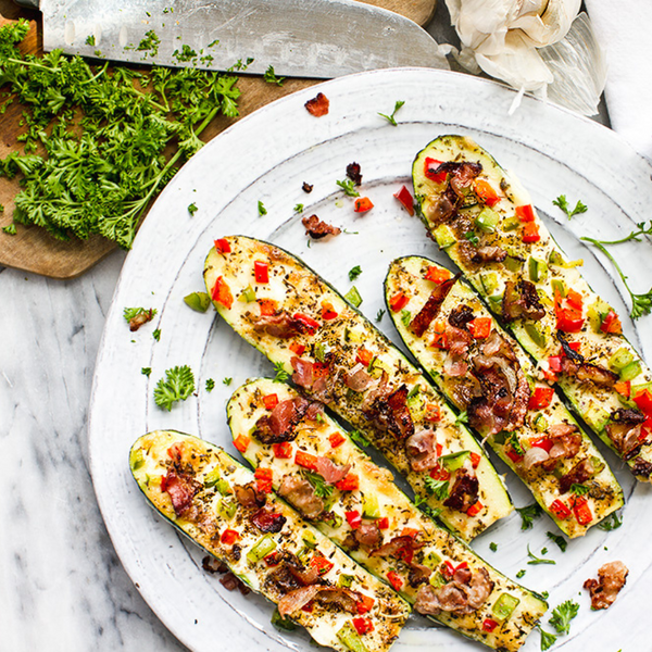 "Cheesy" Zucchini Boats on a white plate