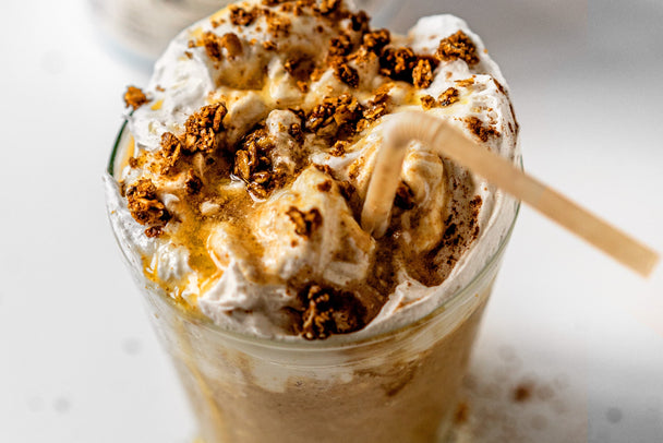 Overhead view of an apple pie smoothie with a straw. 