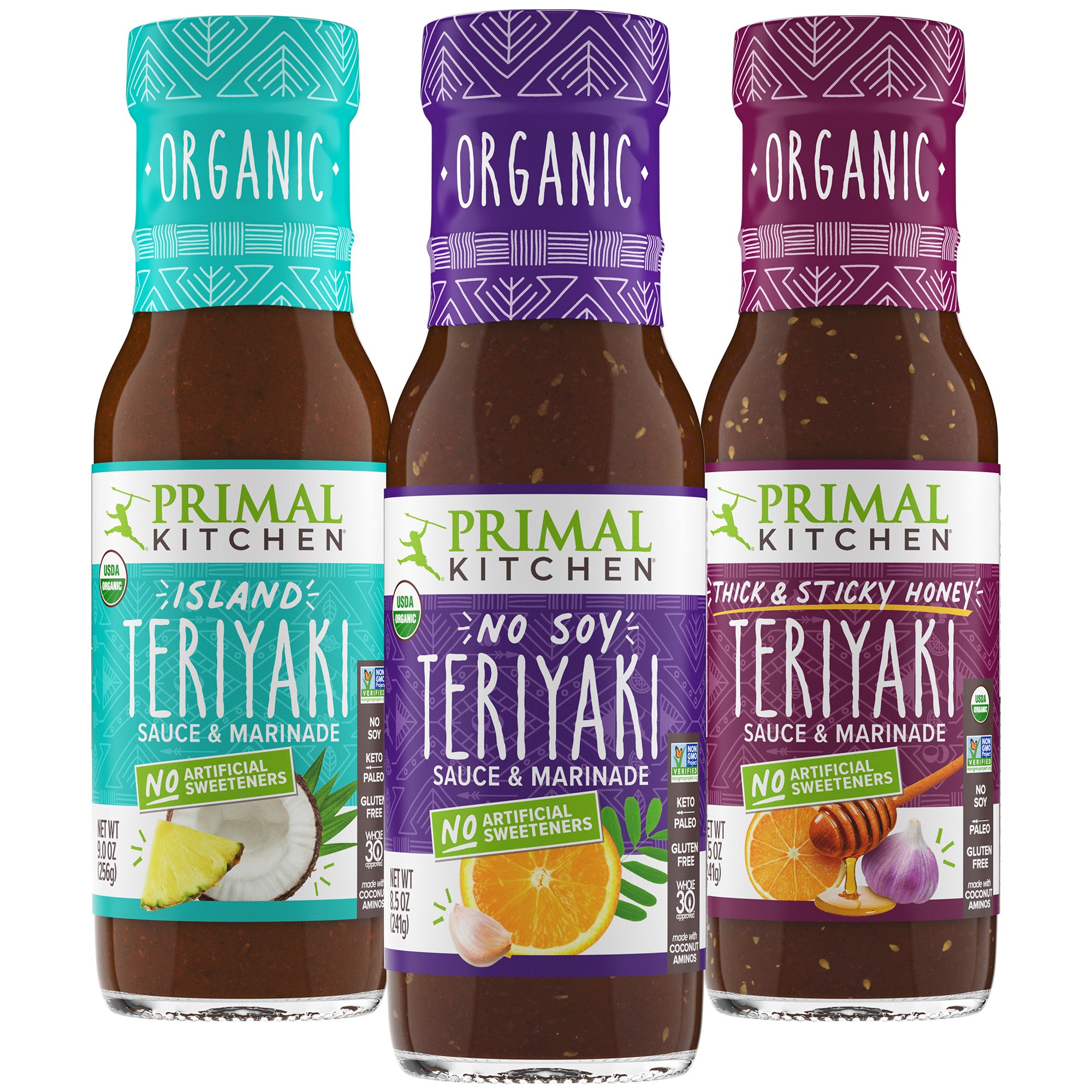 Three bottles of Primal Kitchen Organic Island Teriyaki Sauce & Marinade, Organic No Soy Teriyaki Sauce & Marinade, and Organic Thick & Sticky Teriyaki Sauce & Marinade on a white background