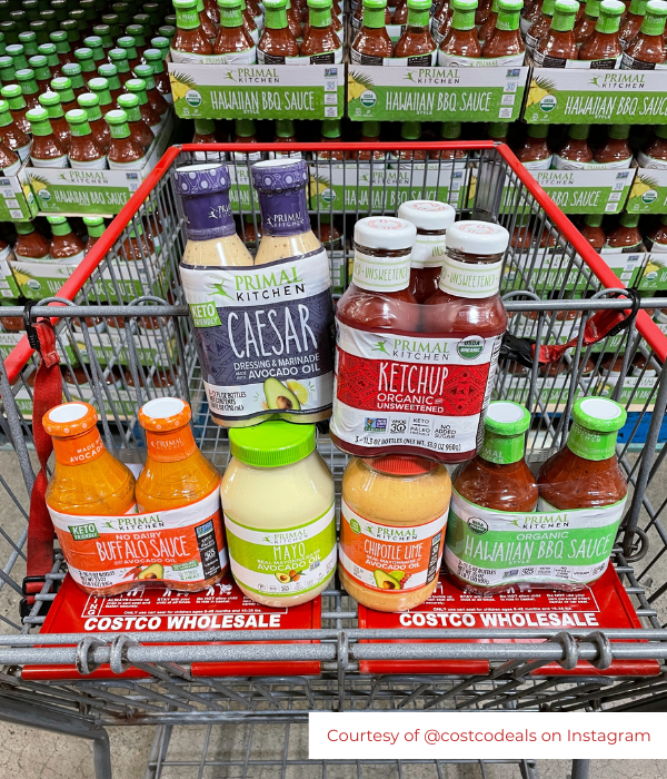 A shopping cart of large sizes of Primal Kitchen condiments