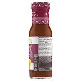 Side view of a bottle of Primal Kitchen Balsamic Vinaigrette Dressing and Marinade made with avocado oil, including nutrition facts and ingredient list, on a light grey background. 