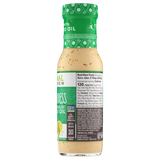Side view of a bottle of Primal Kitchen Green Goddess Dressing & Marinade including nutrition facts and ingredient list.