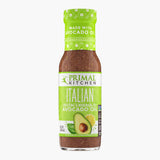 A bottle of Primal Kitchen Italian Vinaigrette Dressing and Marinade made with avocado oil, with a bright green label, on a light grey background.