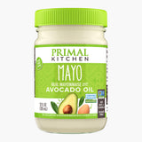 Primal Kitchen Mayo made with Avocado Oil in a glass jar with a green lid.