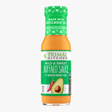 Bottle of Primal Kitchen Mild and Sweet Buffalo Sauce made with Avocado oil on white background