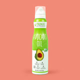 A bottle of Primal Kitchen Avocado Oil Spray with a bright green label on a pink background.