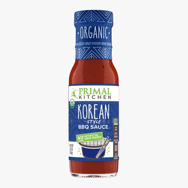 Bottle of Primal Kitchen Organic Korean Style BBQ Sauce with no artificial sweeteners on a white background