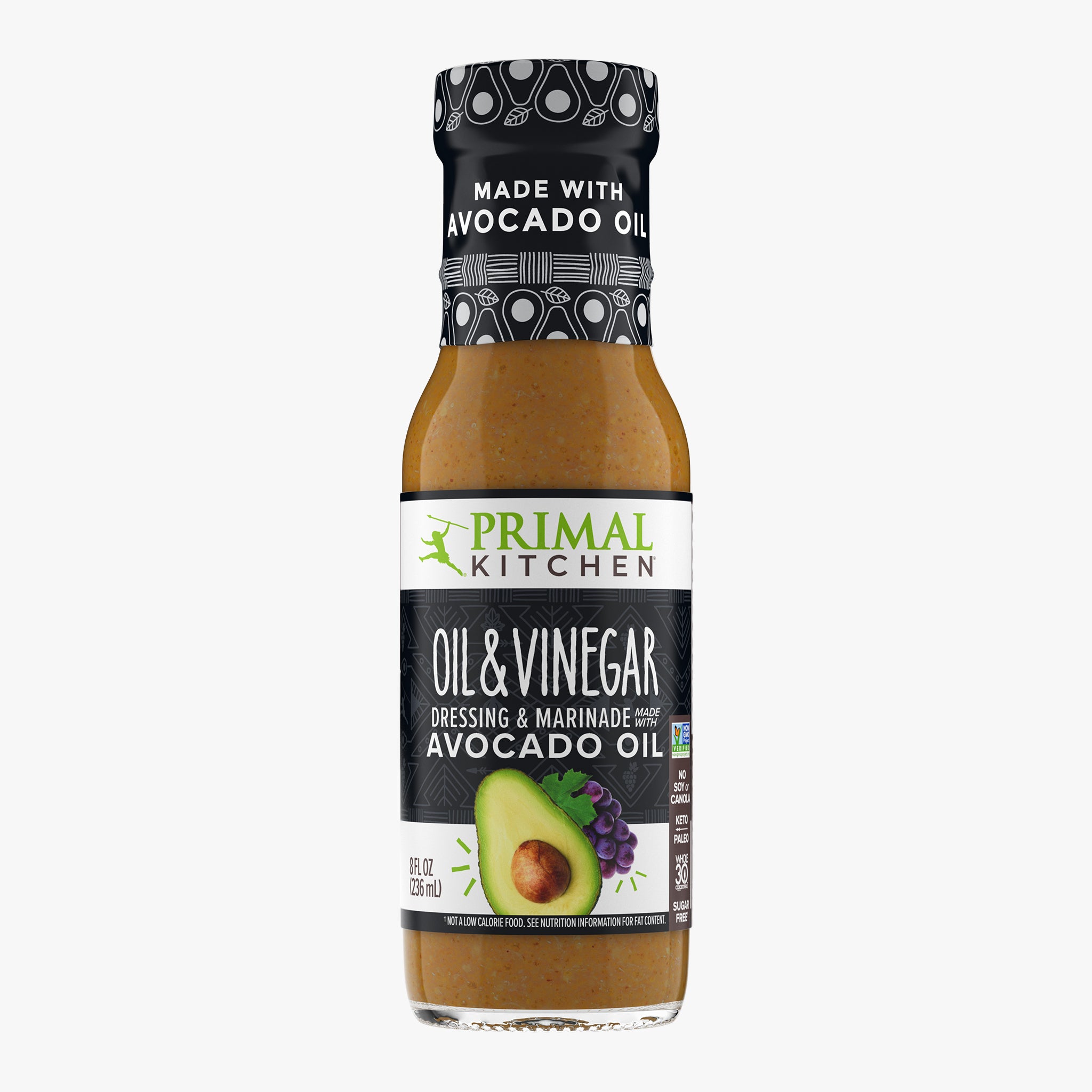 A bottle of Primal Kitchen Oil & Vinegar Dressing and Marinade made with avocado oil, with a black label, on a light grey background.