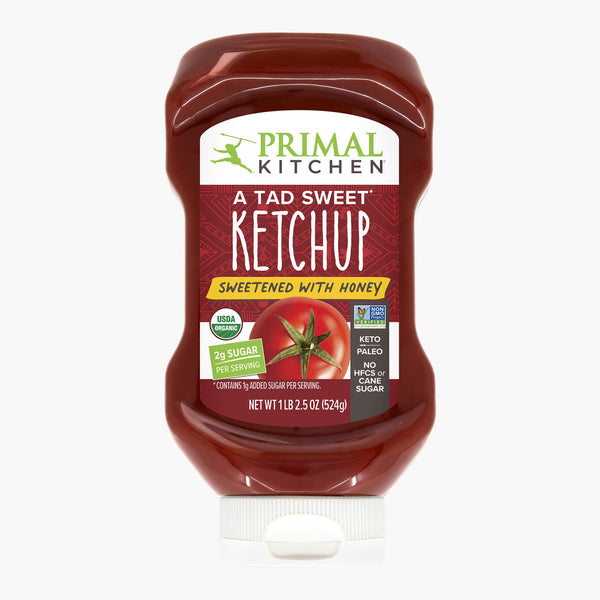 Primal Kitchen A Tad Sweet Squeeze Ketchup - Sweetened With Honey 18.5 oz bottle on a white background