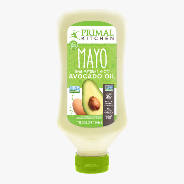 A squeeze bottle of Squeeze Mayo made with Avocado Oil with a green label and lid on a light grey background.