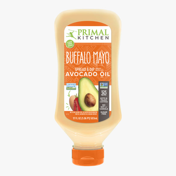 A 17 oz squeeze bottle with an orange cap of Primal Kitchen Buffalo Mayo made with Avocado Oil.