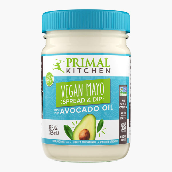 A 12 oz glass jar with a light blue lid of Primal Kitchen Vegan Mayo made with Avocado Oil.