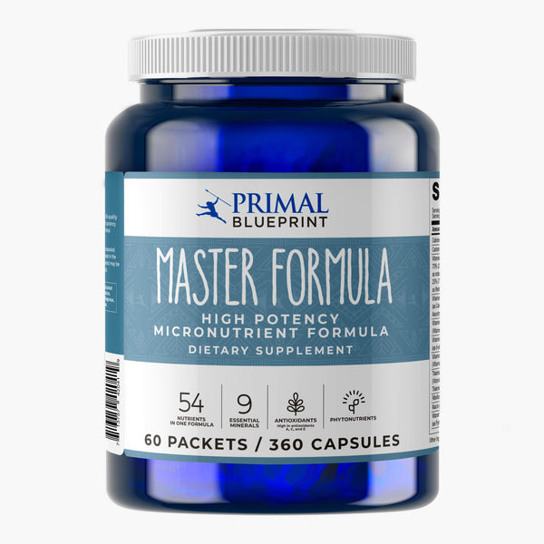 A blue bottle of Primal Blueprint Master Formula with a blue and white label on a light grey background.